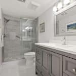 Gray and White Bathroom Remodel With Vanity