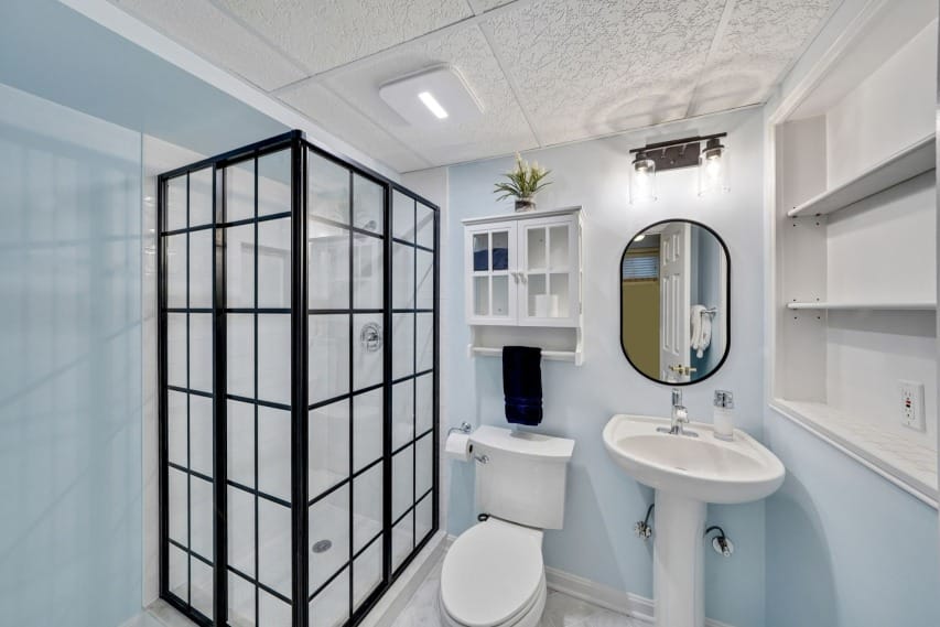 Blue Bathroom Remodel With Enclosed Shower