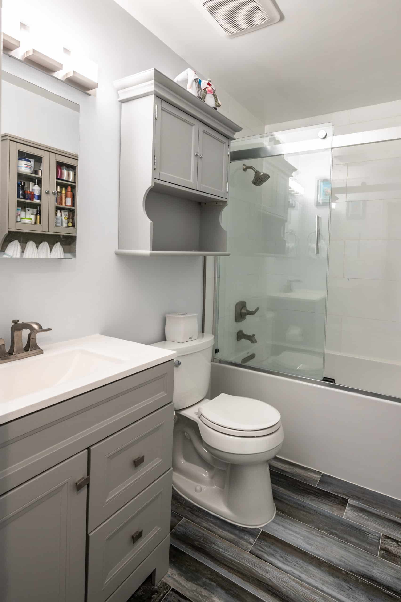 Clean Bathroom Remodel with Two Cabinets